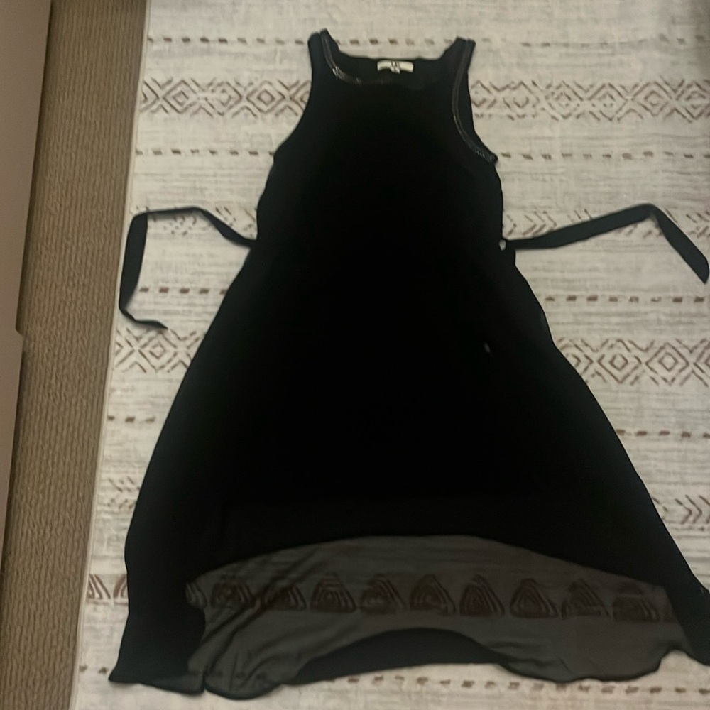 Black dress with sliver detailing around the top, longer in the back, small